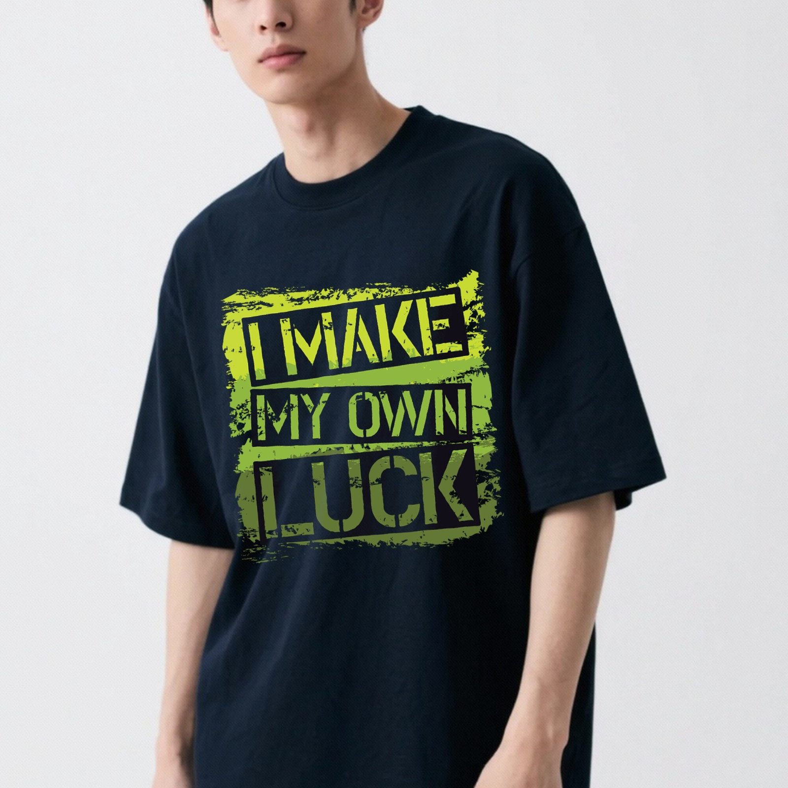 Navy blue men's oversized t-shirt with 'I Make My Own Luck' minimal typography on the front.