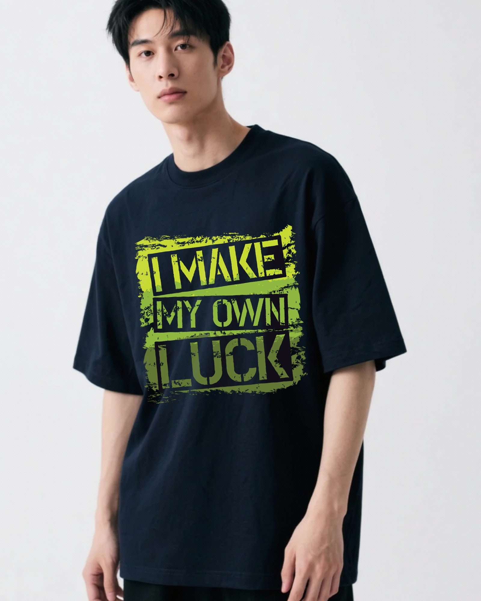 Navy blue men's oversized t-shirt with 'I Make My Own Luck' minimal typography on the front.