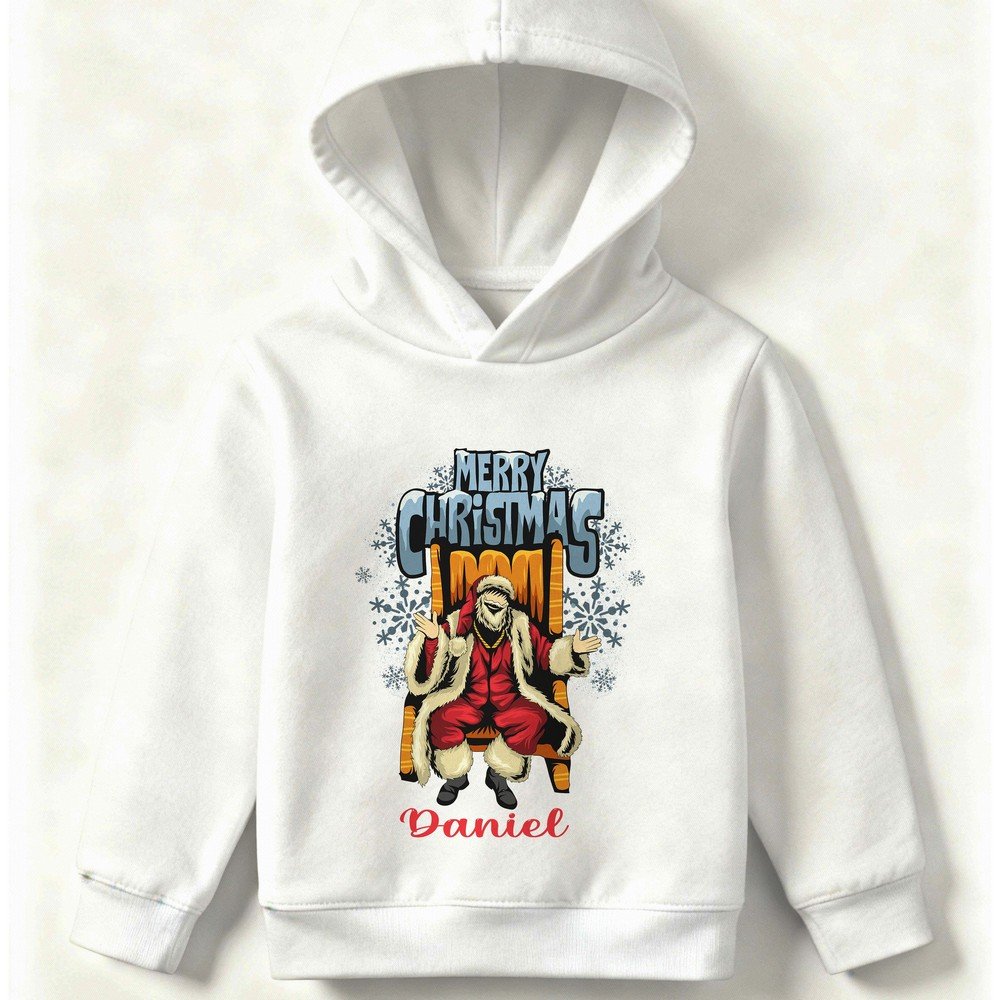 Kid wearing a white Christmas hoodie with Santa illustration and ‘Merry Christmas’ text, festive holiday design, also available in red, black, and grey.