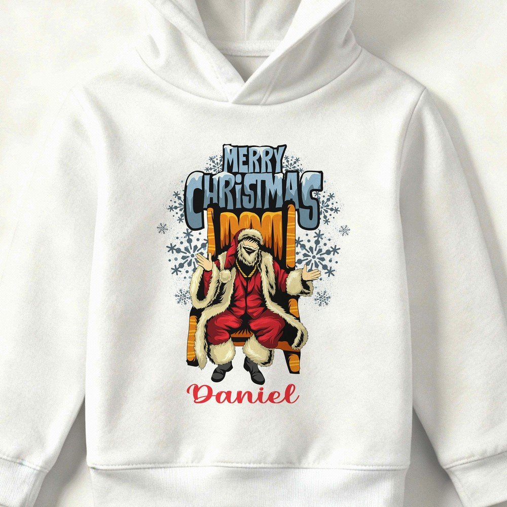 Kid wearing a white Christmas hoodie with Santa illustration and ‘Merry Christmas’ text, festive holiday design, also available in red, black, and grey.