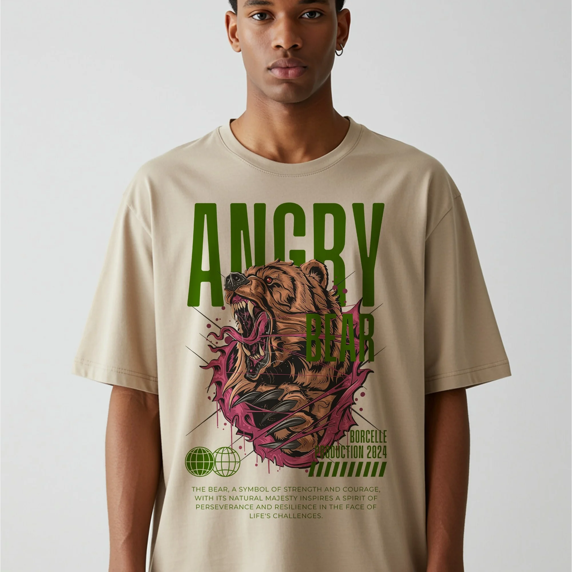 Model wearing a beige oversized streetwear T-shirt featuring a bold bear graphic design.