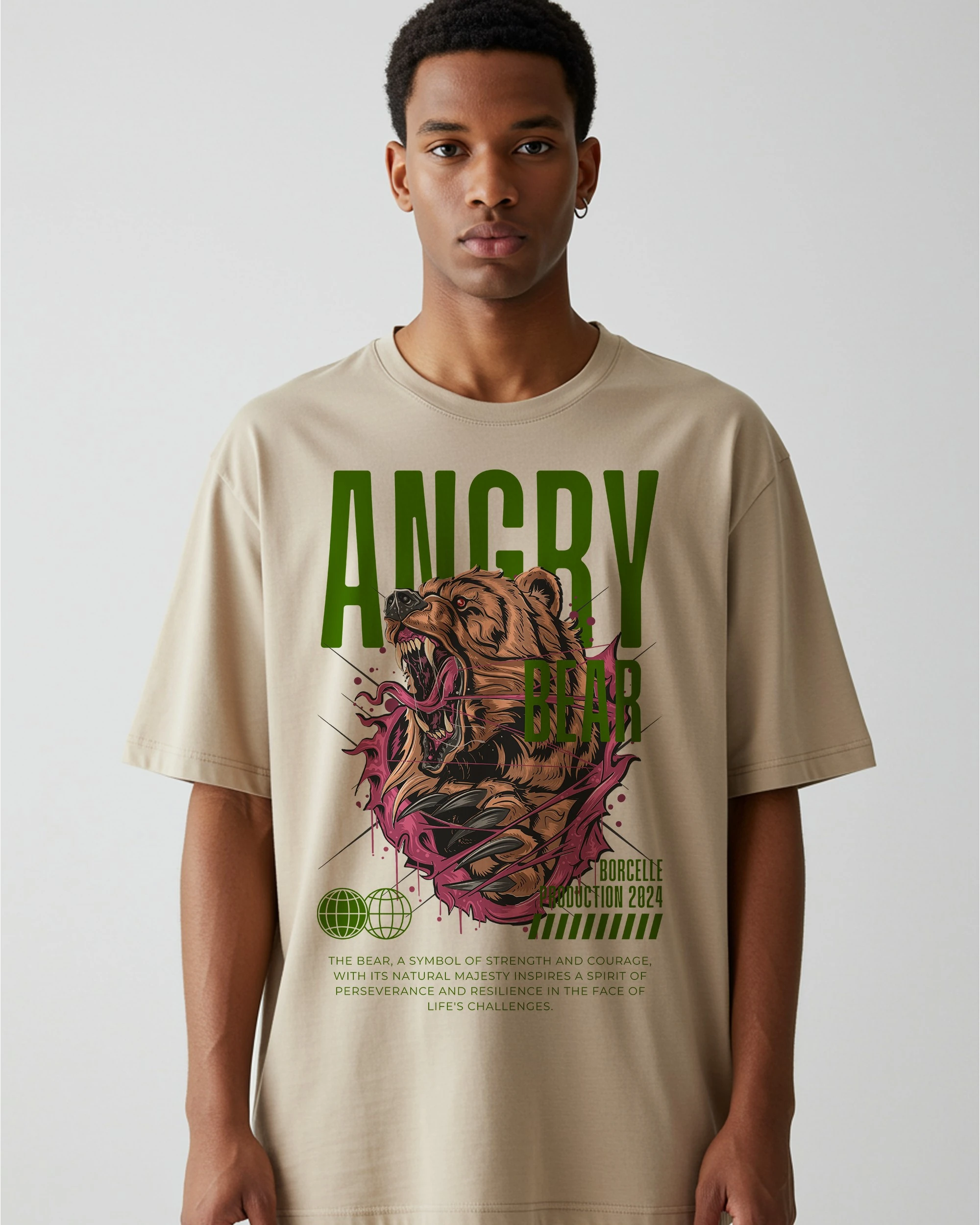 Model wearing a beige oversized streetwear T-shirt featuring a bold bear graphic design.