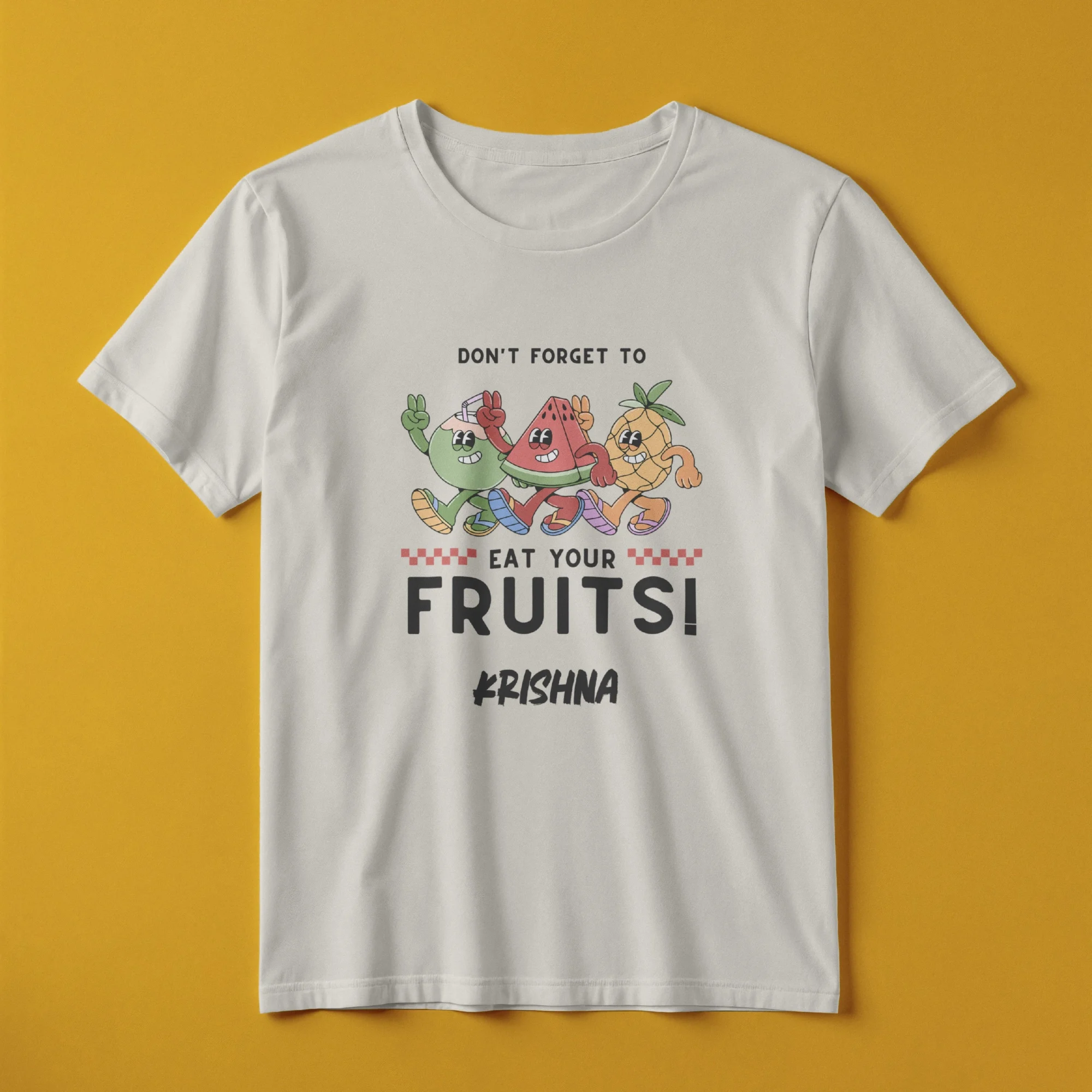 Child wearing a white personalized kids T-shirt with a custom name and "Don't Forget to Eat Your Fruits" colorful fruit design.