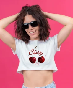Women wearing a white crop top with cherry print design
