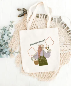 Premium canvas tote bag with zipper and "Bloom Like Flowers" floral design – product photo